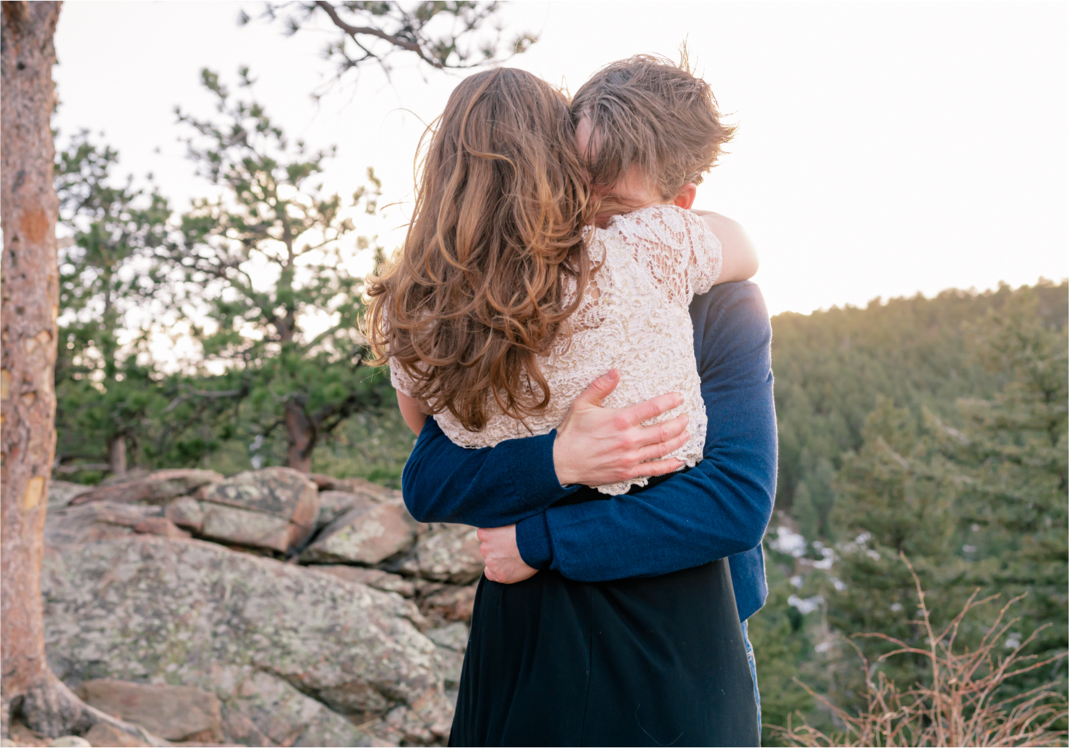 Winter Engagement on Lookout Mountain in Golden Colorado | Britni Girard Photography | Destination Photo and Video Team | Epic views of Golden, dreamy sunsets, dancing and snuggles.  A sweet couple shares time of prayer together during their romantic engagement session.