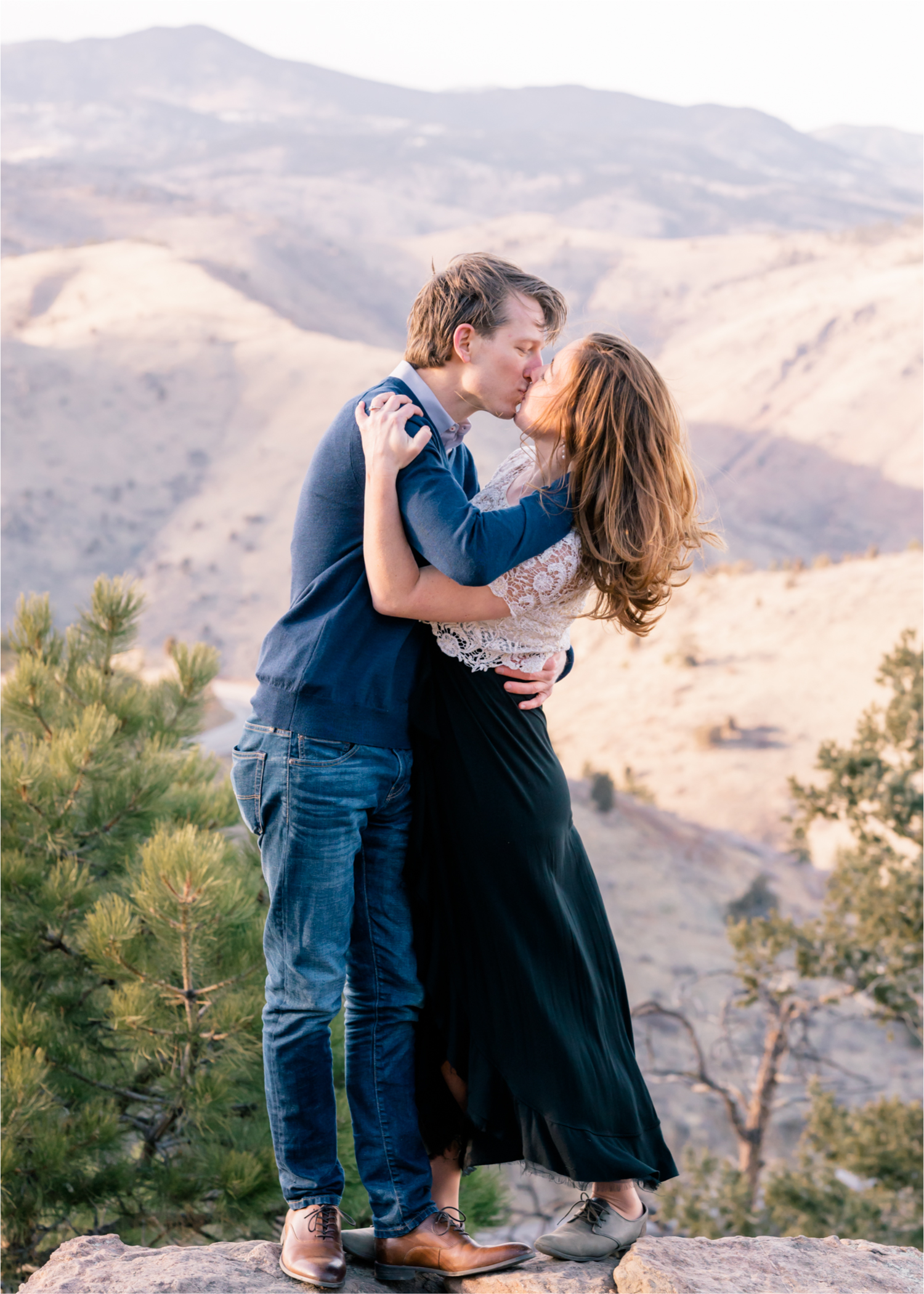Winter Engagement on Lookout Mountain in Golden Colorado | Britni Girard Photography | Destination Photo and Video Team | Epic views of Golden, dreamy sunsets, dancing and snuggles.  A sweet couple shares time of prayer together during their romantic engagement session.