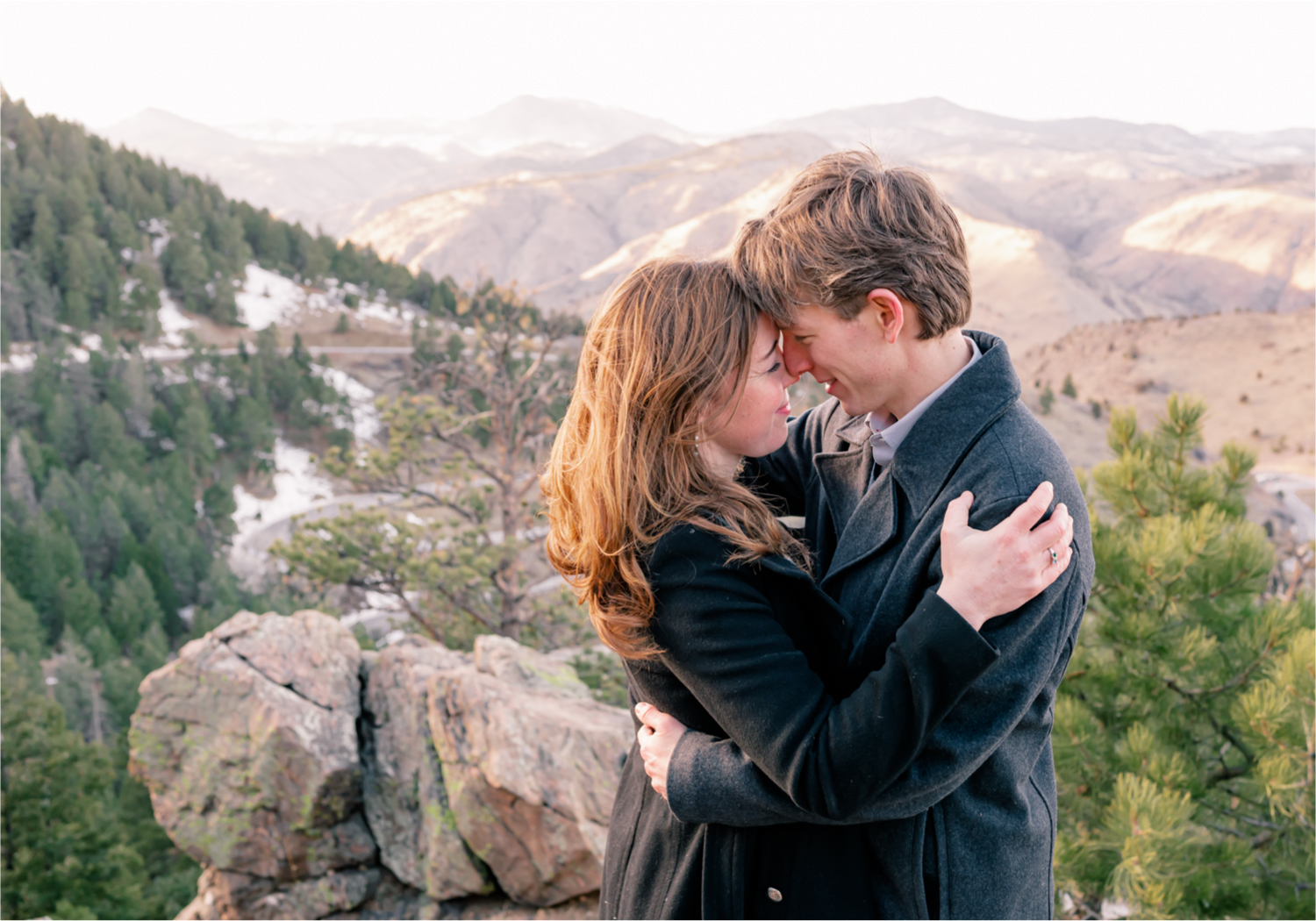 Winter Engagement on Lookout Mountain in Golden Colorado | Britni Girard Photography | Destination Photo and Video Team | Epic views of Golden, dreamy sunsets, dancing and snuggles.  A sweet couple shares time of prayer together during their romantic engagement session.