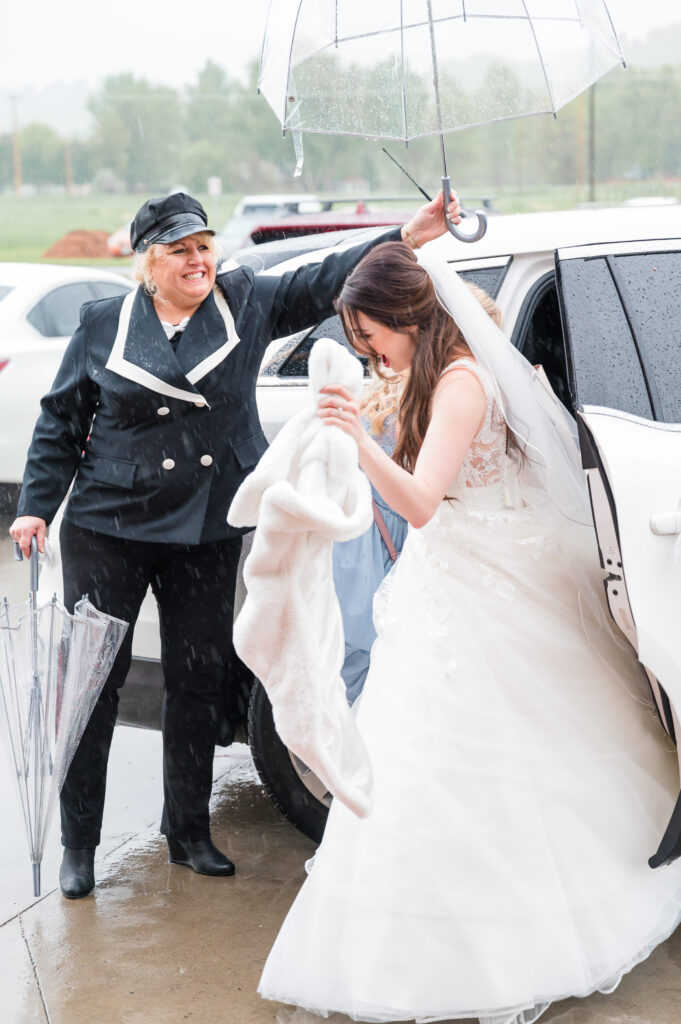 Rain on Wedding Day at sweet heart winery | Britni Girard Photography - Bride and Groom run from limo to indoors under clear umbrella